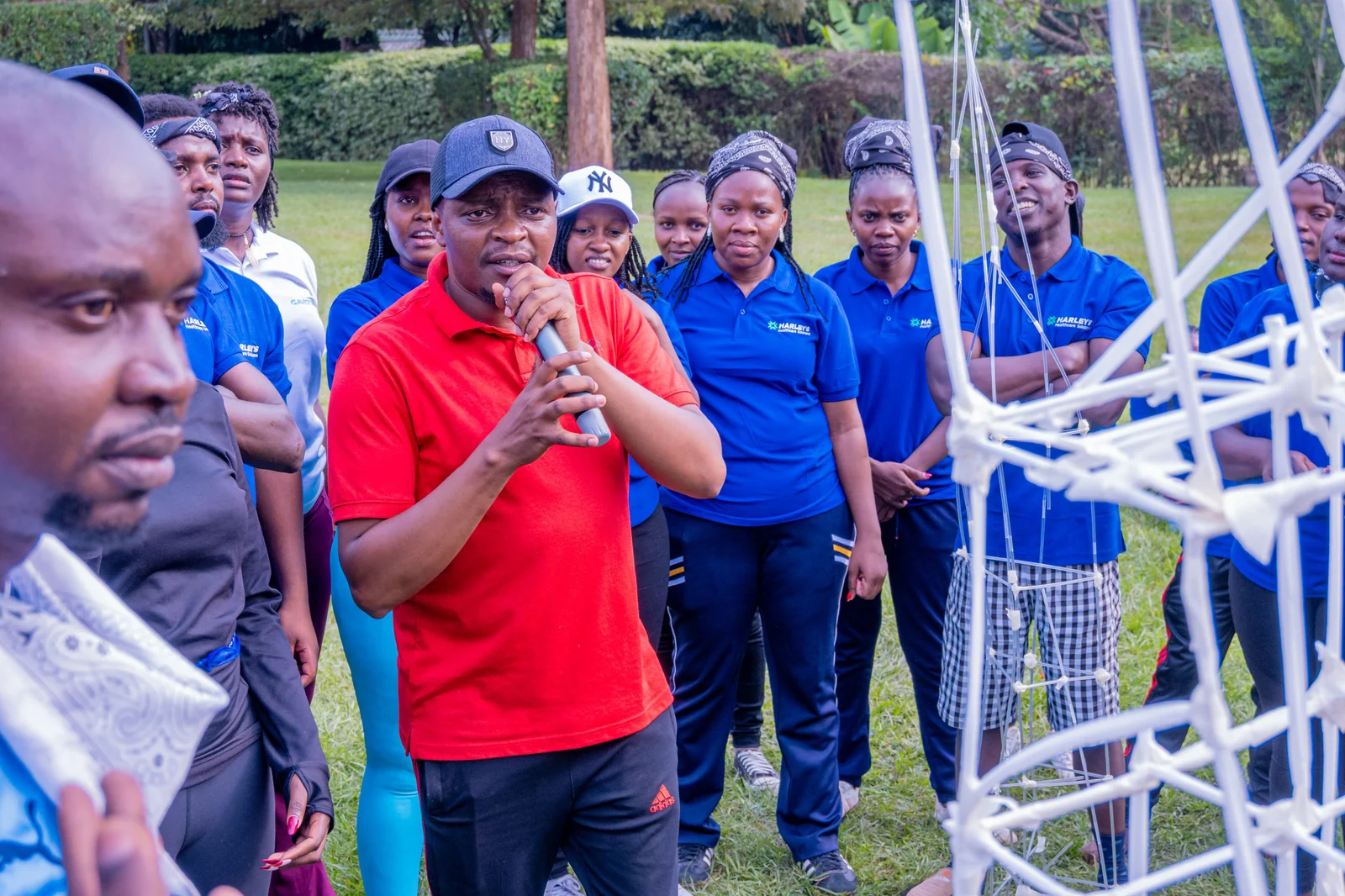 A facilitator explaining a rope activity to a group